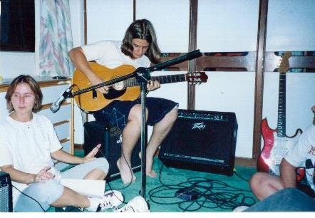 me and 2 of my guitars, my mother to the left
